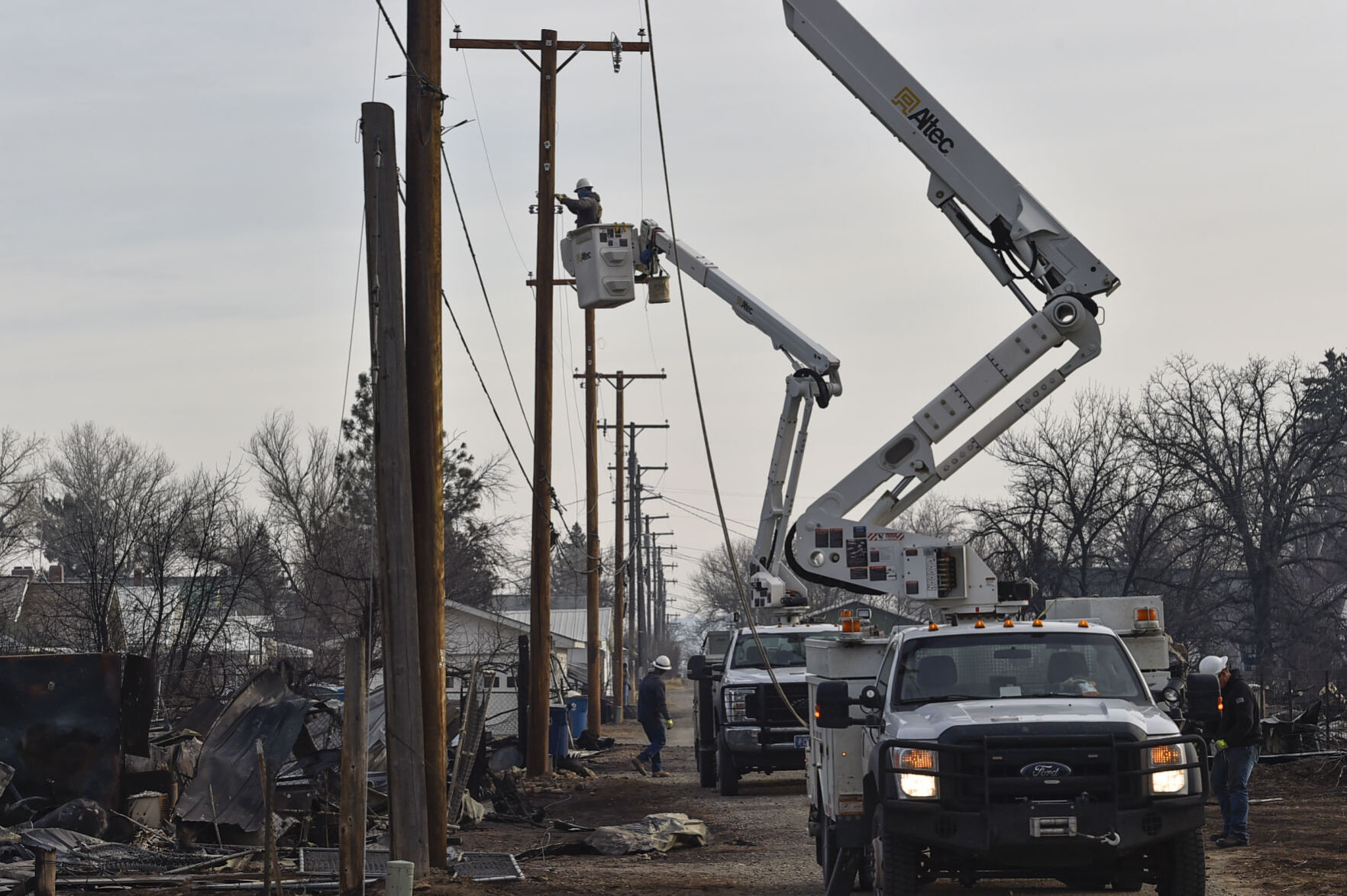 Northwestern Energy technicians work to repair power lines